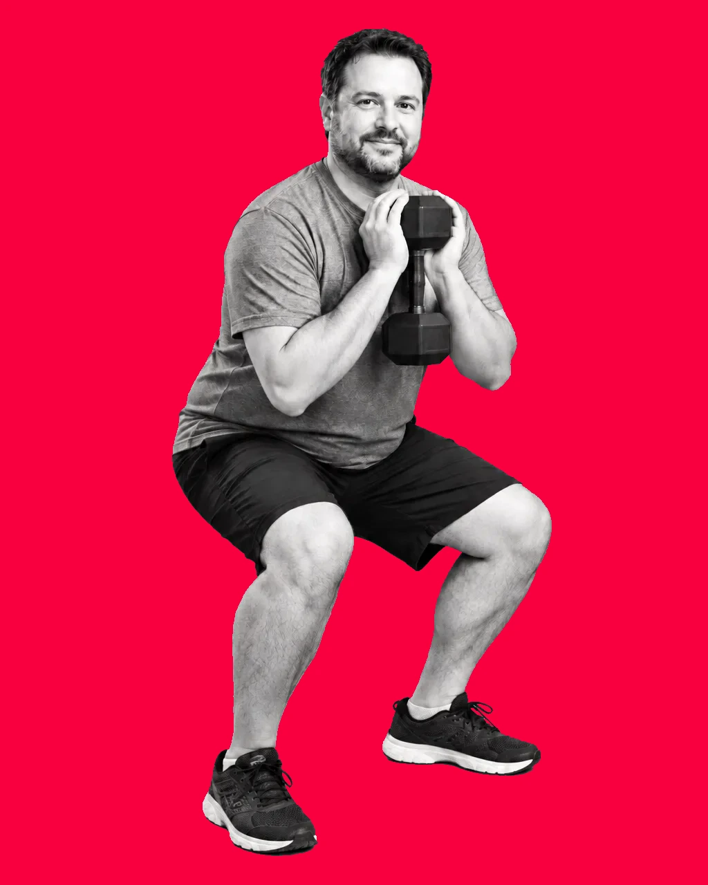 Everyday man performing a goblet squat with a dumbbell